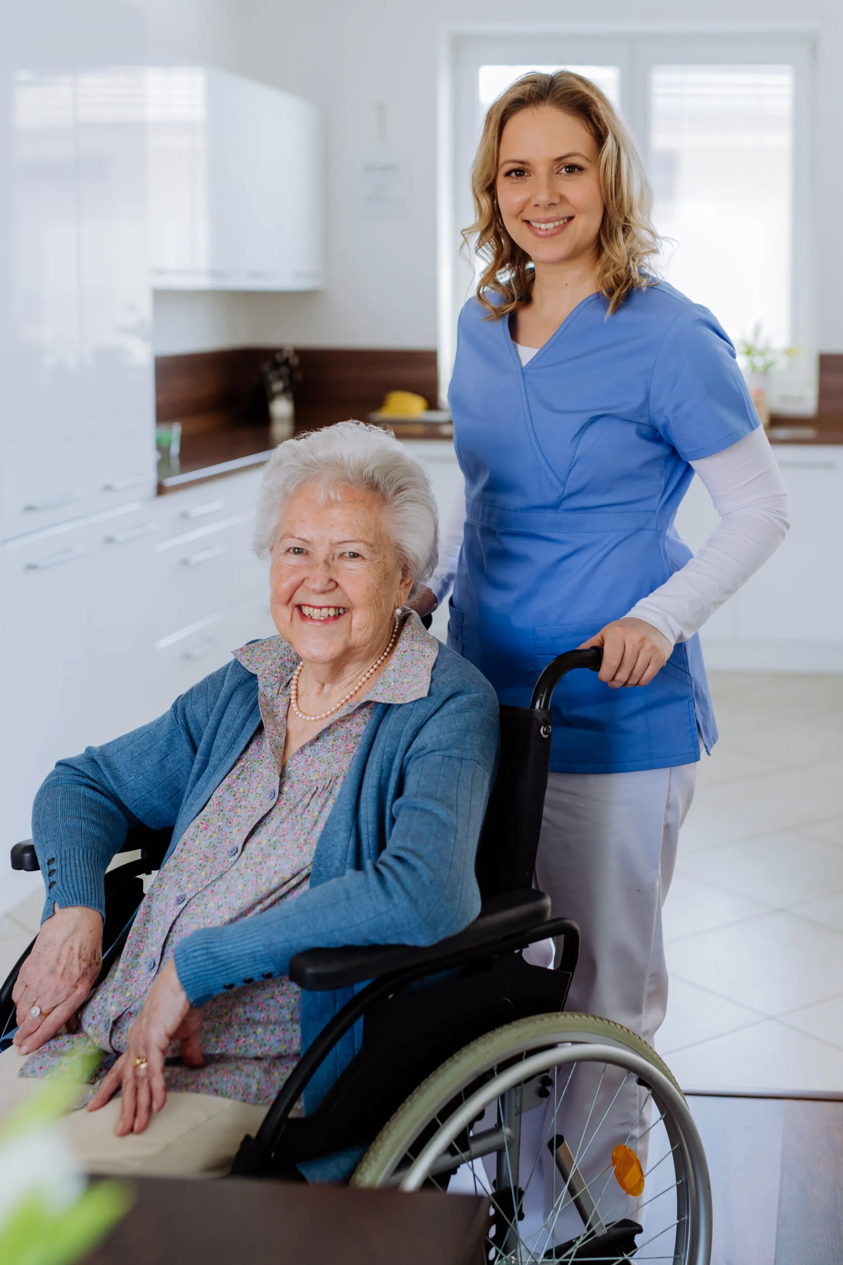 at home health care Michigan caregiver with senior in wheelchair at home
