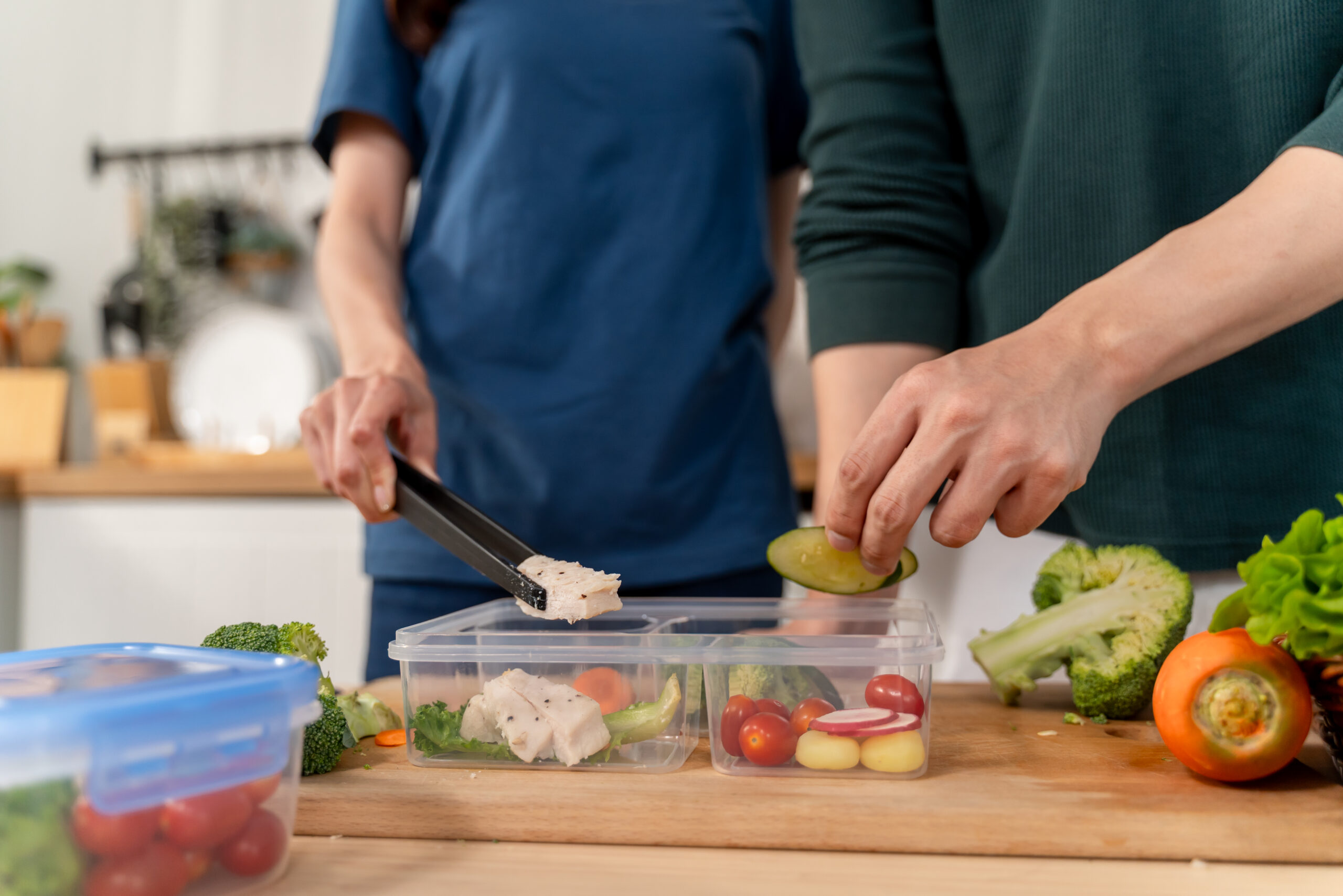 caregiver providing meal preparation for elderly Tequesta FL with healthy home-cooked senior meal