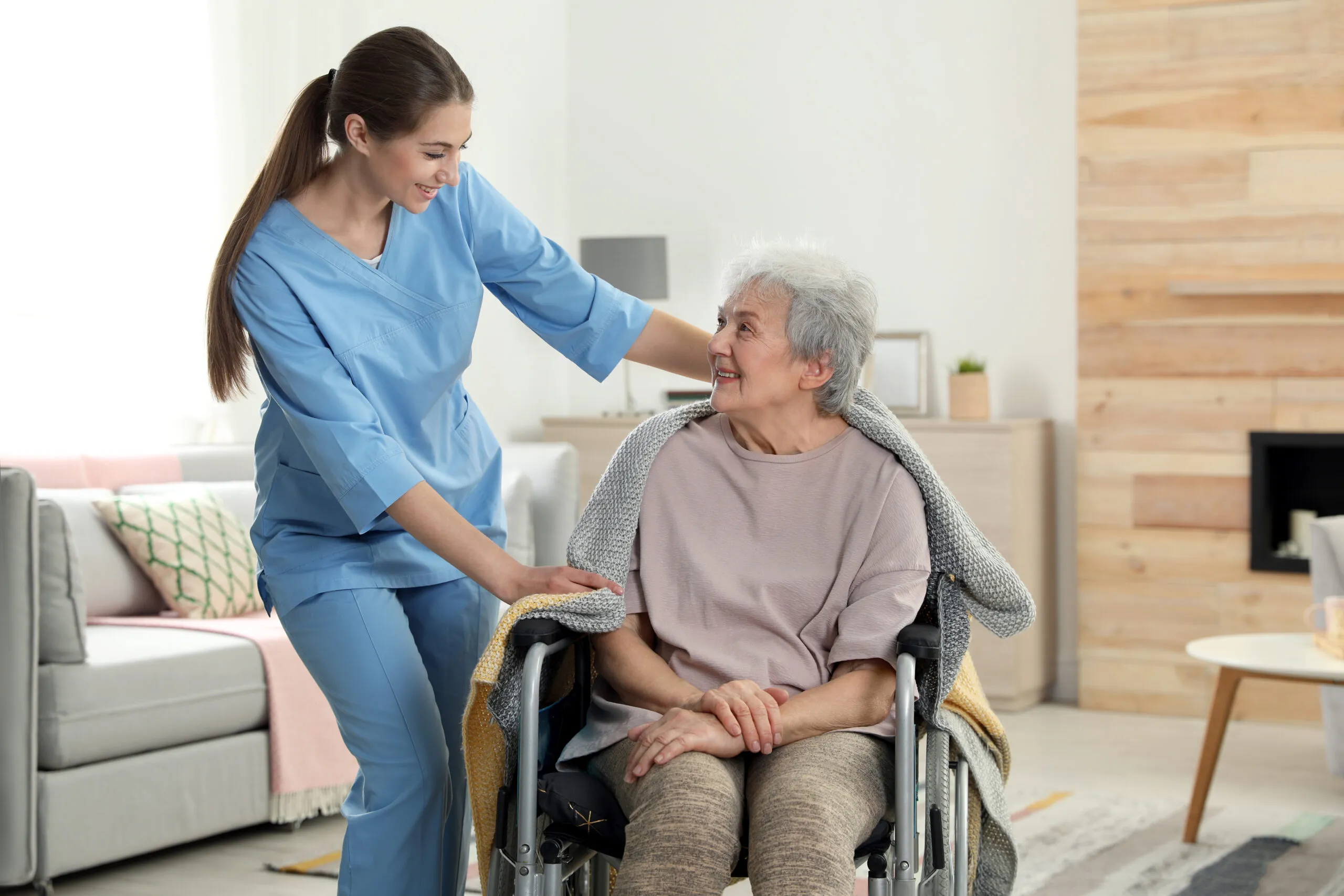 Compassionate senior home care Westland, MI caregiver providing personal care and companionship support to an elderly client at home